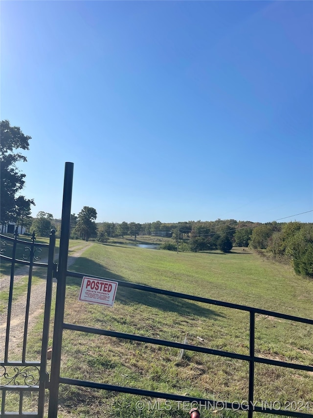 view of yard with a rural view