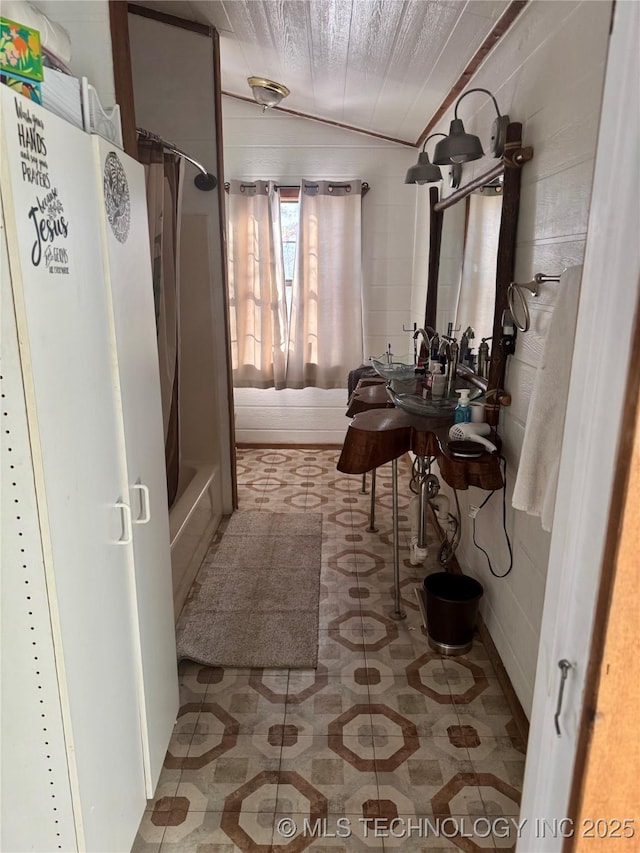 bathroom with shower / bath combination with curtain, wooden ceiling, and vaulted ceiling