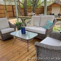 wooden deck featuring outdoor lounge area