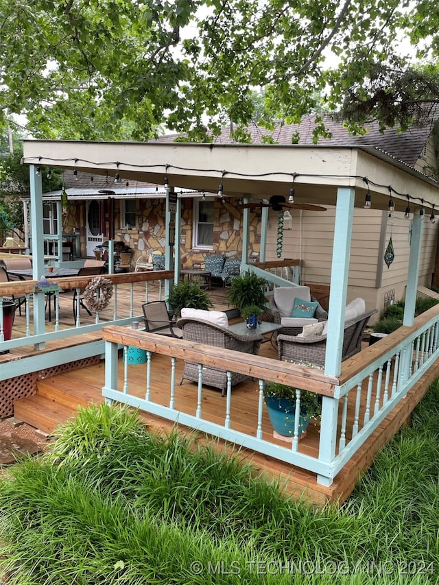 rear view of house featuring an outdoor hangout area and a deck