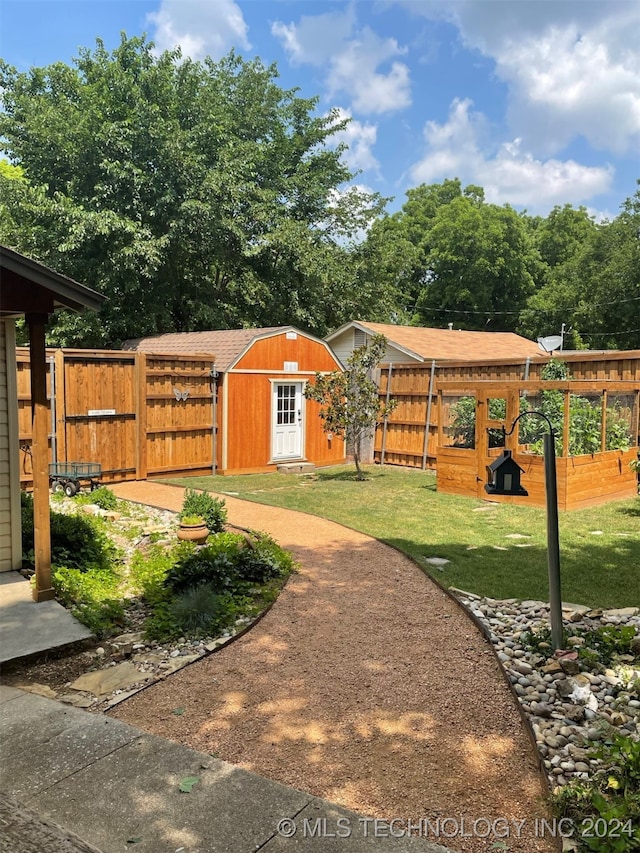 view of yard featuring a playground and a shed