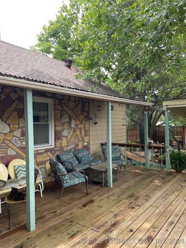 wooden terrace featuring outdoor lounge area