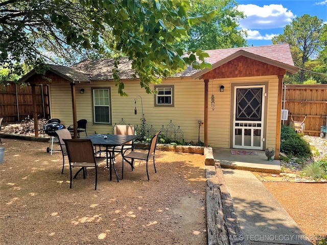 back of property with a patio area