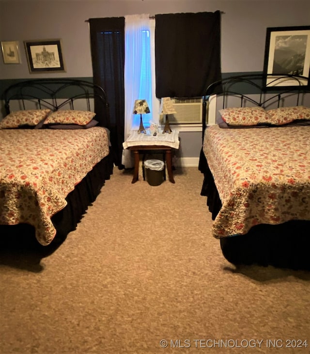 bedroom featuring cooling unit and carpet flooring