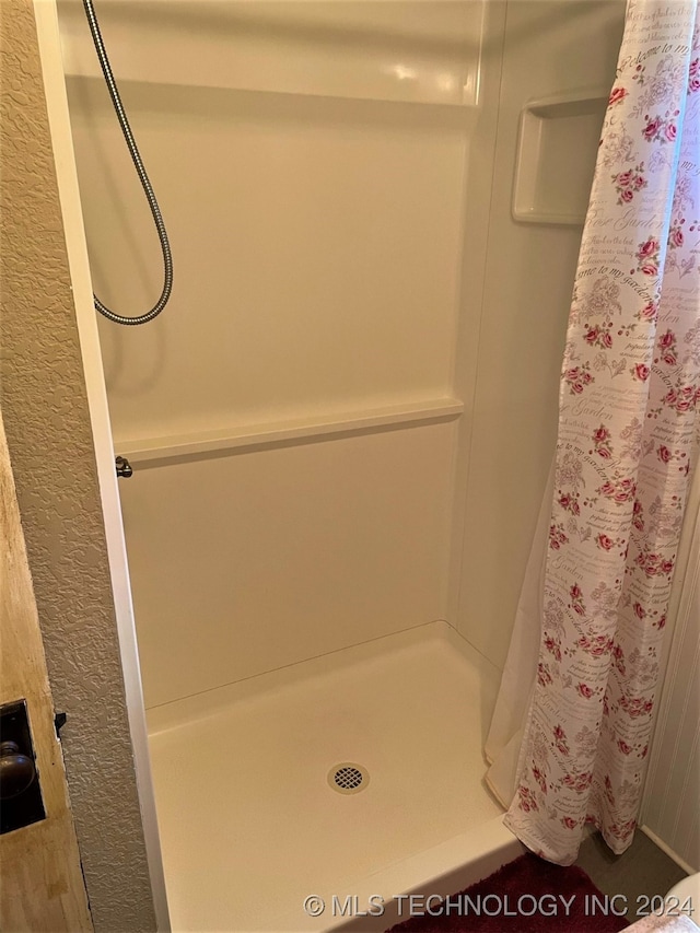 bathroom featuring walk in shower