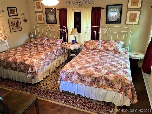 bedroom featuring hardwood / wood-style flooring