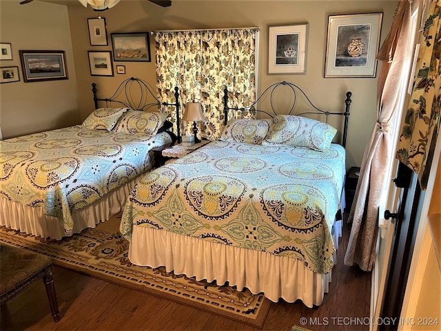 bedroom with hardwood / wood-style floors