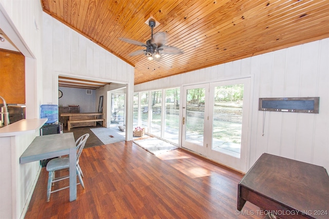 interior space featuring lofted ceiling, ceiling fan, and wooden ceiling