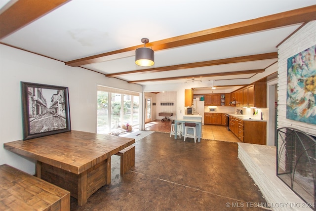 dining room with beam ceiling