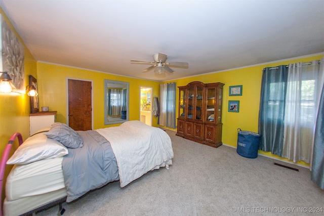 bedroom featuring light carpet, ceiling fan, multiple windows, and crown molding