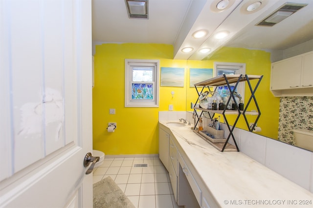 bathroom featuring vanity, toilet, and tile patterned floors