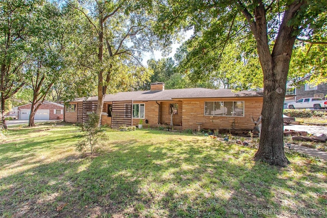 ranch-style home featuring a front yard