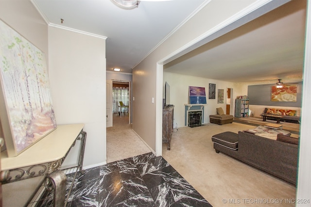 hallway with ornamental molding and light colored carpet