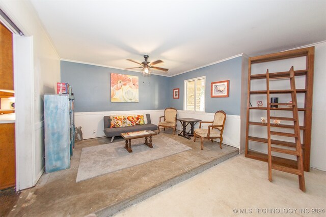 sitting room with ornamental molding and ceiling fan