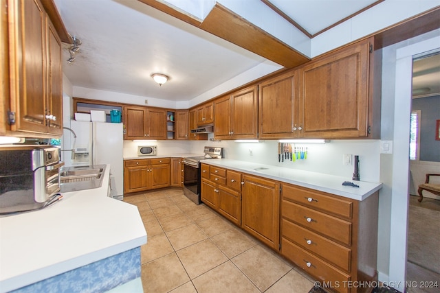 kitchen featuring white appliances and light tile patterned floors