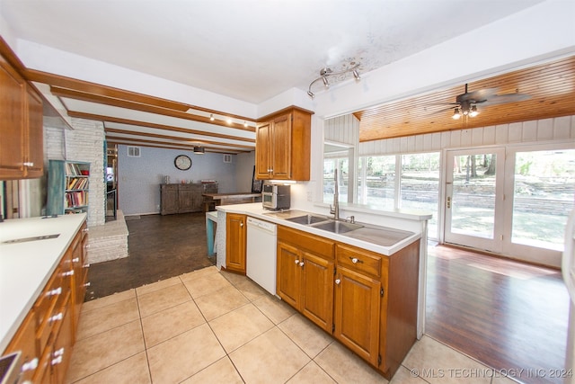 kitchen with light wood-type flooring, white dishwasher, ceiling fan, and sink