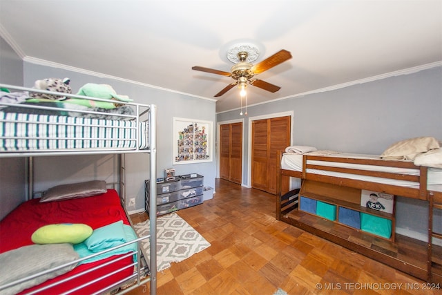 bedroom featuring parquet flooring, ornamental molding, and ceiling fan