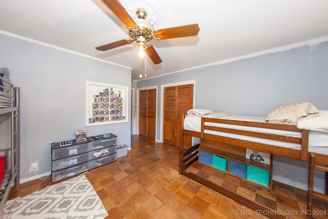 bedroom with ceiling fan, crown molding, and parquet floors