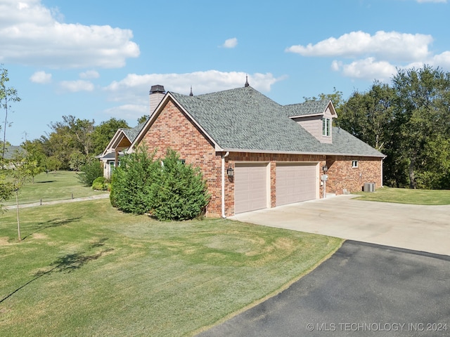 view of property exterior with a lawn and a garage