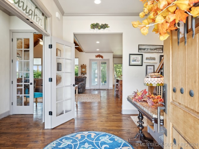 foyer featuring ornamental molding, dark hardwood / wood-style floors, and french doors