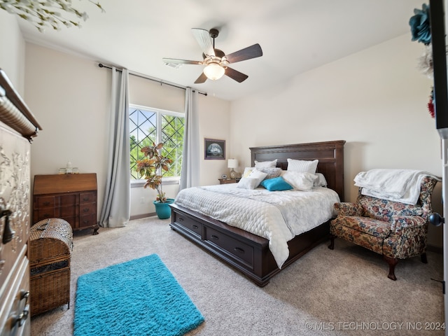 bedroom featuring ceiling fan and light colored carpet