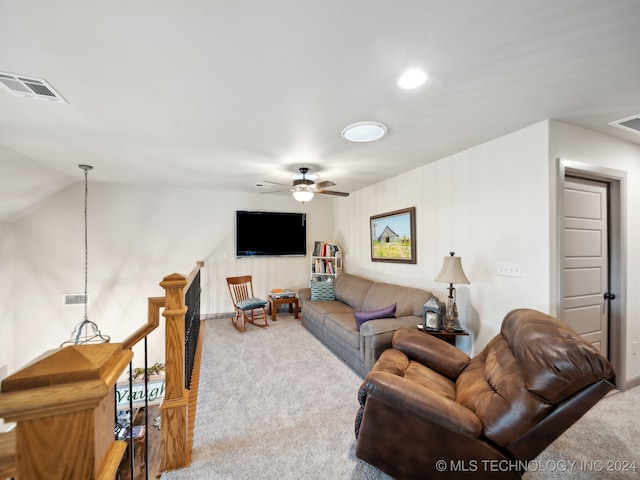 carpeted living room with vaulted ceiling and ceiling fan