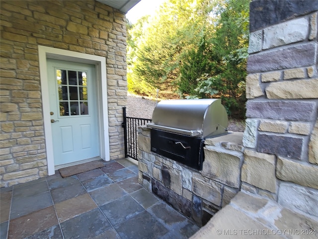 view of patio with a grill and exterior kitchen