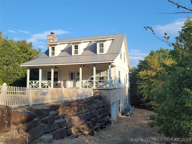 view of front of property featuring a porch and central AC