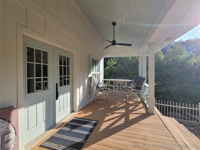 wooden terrace featuring ceiling fan