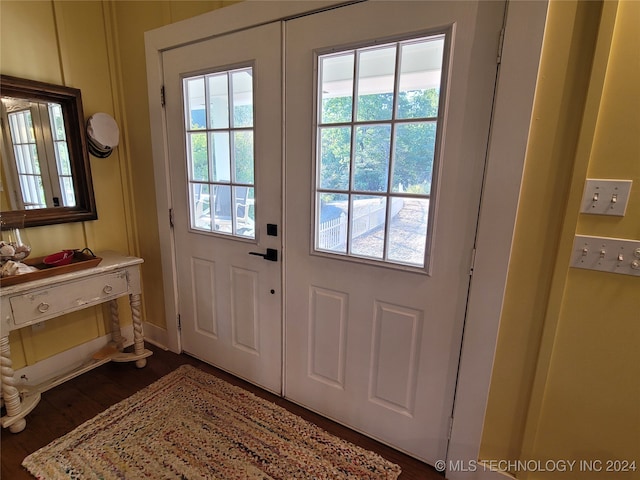 doorway to outside featuring dark hardwood / wood-style flooring