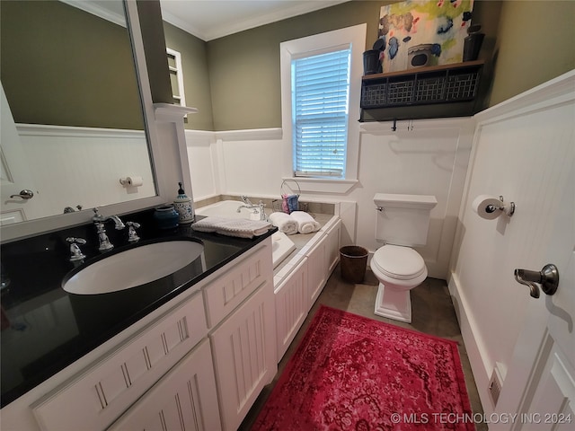 bathroom with ornamental molding, vanity, and toilet