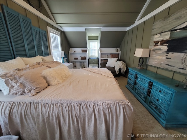 bedroom featuring carpet floors and vaulted ceiling