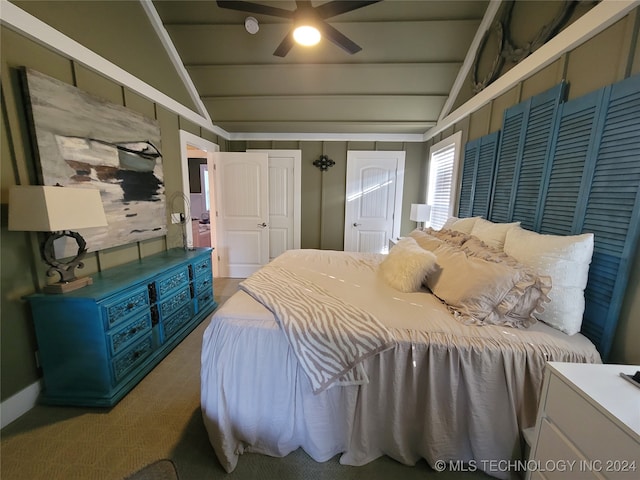 carpeted bedroom featuring ceiling fan and lofted ceiling with beams