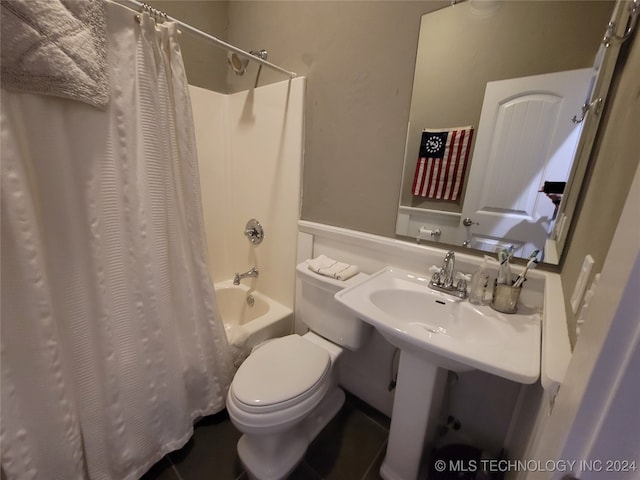 bathroom with shower / tub combo and toilet