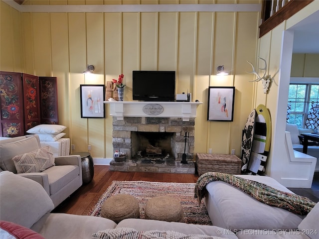 living room featuring a fireplace and dark hardwood / wood-style flooring