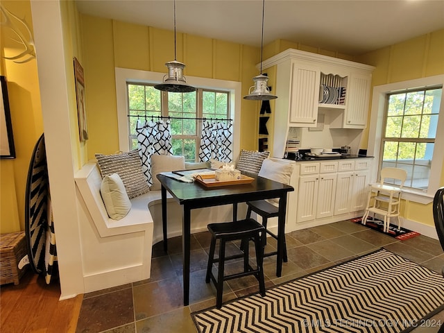 dining space with dark wood-type flooring