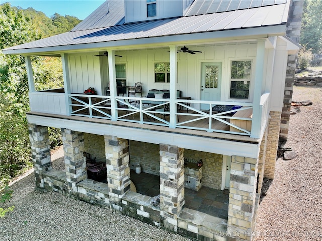 rear view of house with ceiling fan