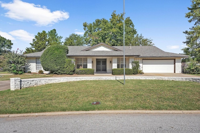 ranch-style house with a front lawn and a garage