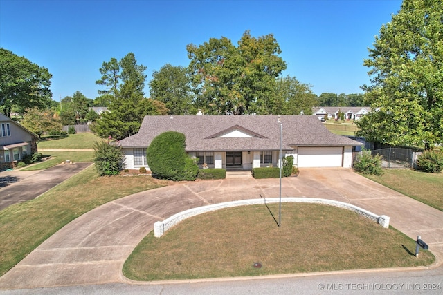 ranch-style home with a front yard and a garage