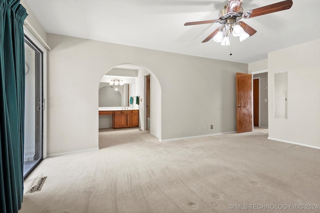 unfurnished room featuring ceiling fan, light colored carpet, and electric panel