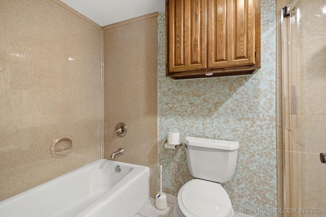 bathroom featuring shower / washtub combination and toilet