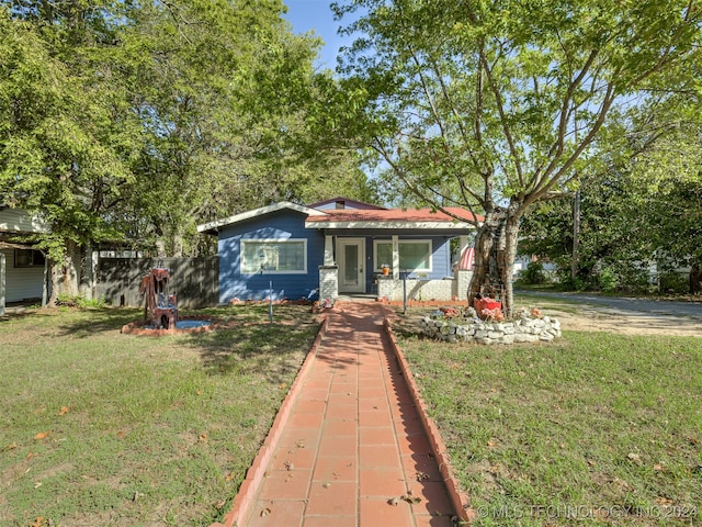 view of front of home with a front lawn