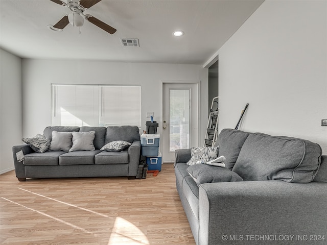 living room with ceiling fan and hardwood / wood-style floors