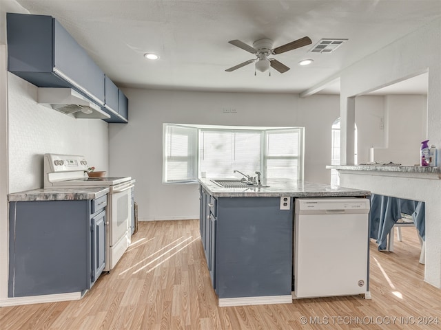 kitchen with sink, light hardwood / wood-style flooring, white appliances, ceiling fan, and blue cabinetry