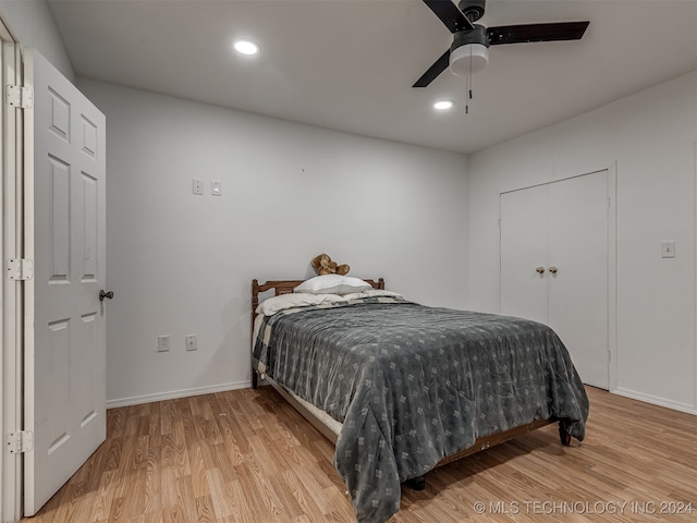 bedroom with ceiling fan and light wood-type flooring