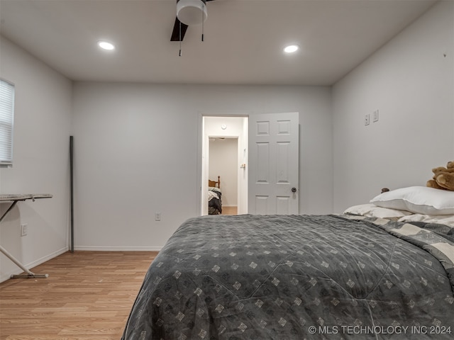 bedroom with ceiling fan and light hardwood / wood-style floors