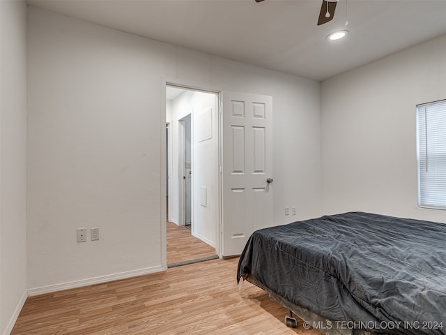 bedroom with ceiling fan and light hardwood / wood-style flooring