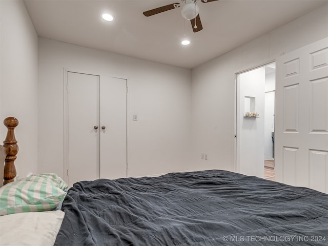 bedroom featuring ceiling fan and hardwood / wood-style flooring