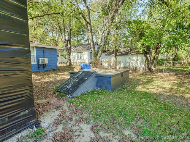 view of storm shelter with a yard