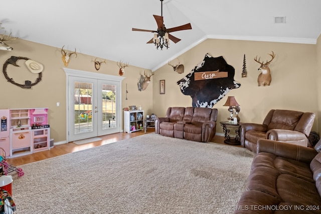 living room featuring wood-type flooring, lofted ceiling, crown molding, ceiling fan, and french doors